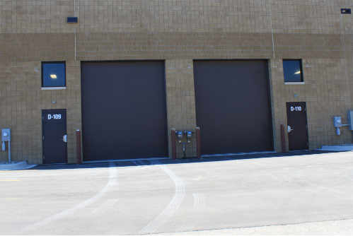 Grade-level overhead doors with drive-in truck access at Lynn Corporate Park warehouse