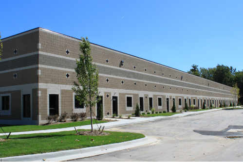Building D exterior with professional landscaping at Lynn Corporate Park